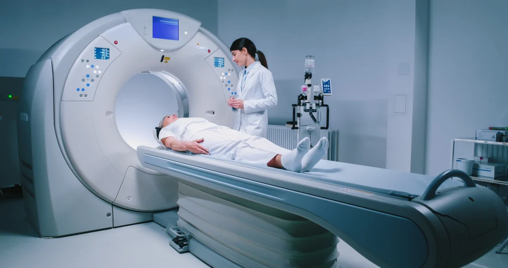 Person getting CT scan for chest pain; MRI cost without insurance