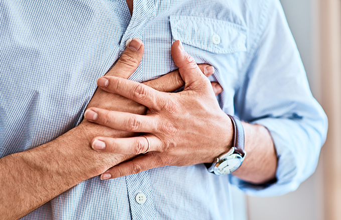 Man with chest pain; cardiovascular disease is a health problem that CT scans can help find